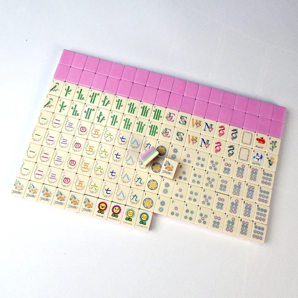 A full American mahjong set laid out in rows, with pink-edged tiles