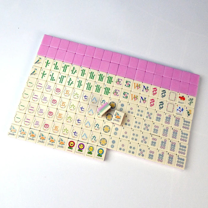 A full American mahjong set laid out in rows, with pink-edged tiles